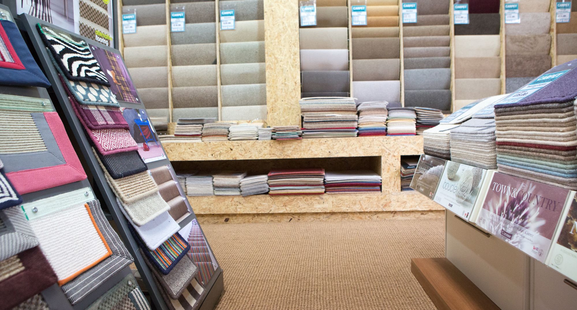 The showroom: walls of carpet sample books, runner swatches and a sisal floor